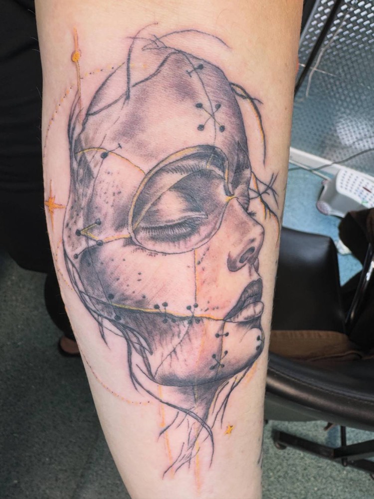 Woman's face with a geometric line design